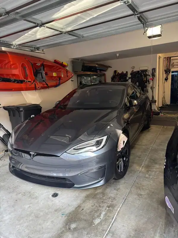 Tesla Model S front view in garage before ceramic window tint — mobile tinting San Diego