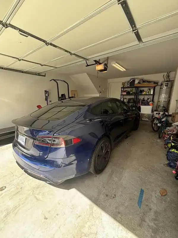 Deep Blue Metallic 2021 Tesla Model S Plaid rear three-quarter view in customer garage with PLAID badge after ceramic IR window tint install — BestAutoTechs San Diego mobile EV service