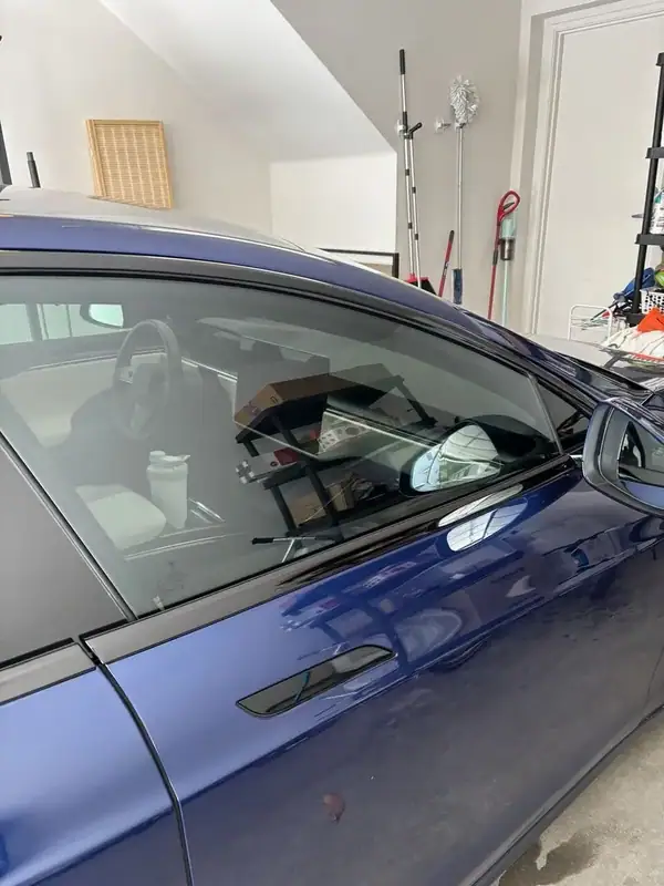 2021 Tesla Model S Plaid front driver door close-up after ceramic window tint install with yoke steering wheel visible — BestAutoTechs San Diego mobile EV