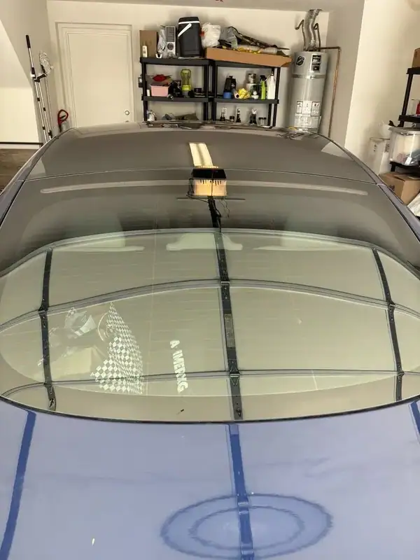 2021 Tesla Model S Plaid panoramic rear glass during ceramic IR window tint installation showing professional film prep — BestAutoTechs mobile San Diego