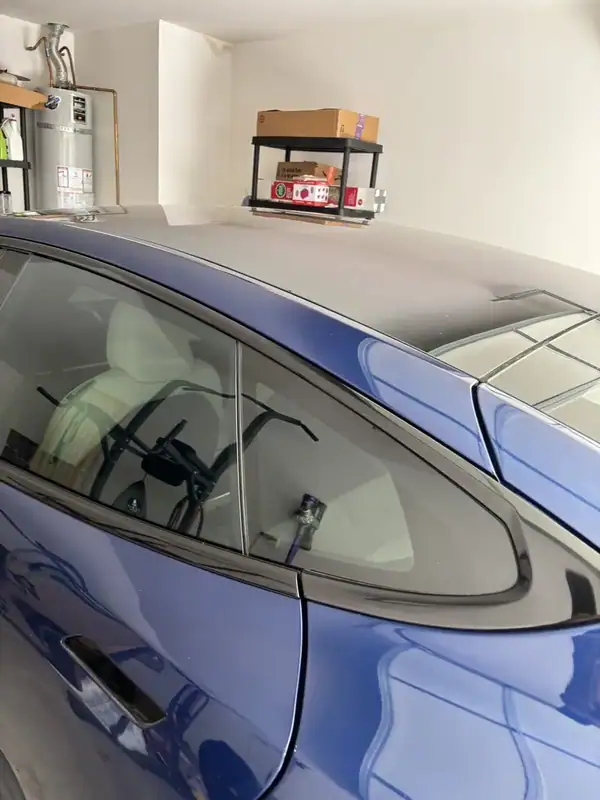 Deep Blue Metallic 2021 Tesla Model S Plaid driver side rear quarter glass after HiTek ceramic IR window tint installation — San Diego mobile auto window tinting
