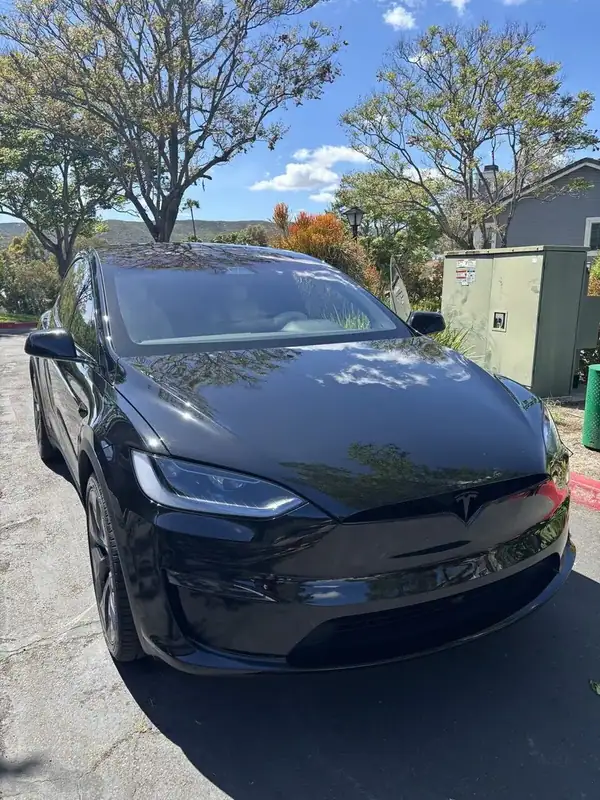 Black Tesla Model X front three-quarter view after ceramic IR window tint install — BestAutoTechs San Diego mobile EV service