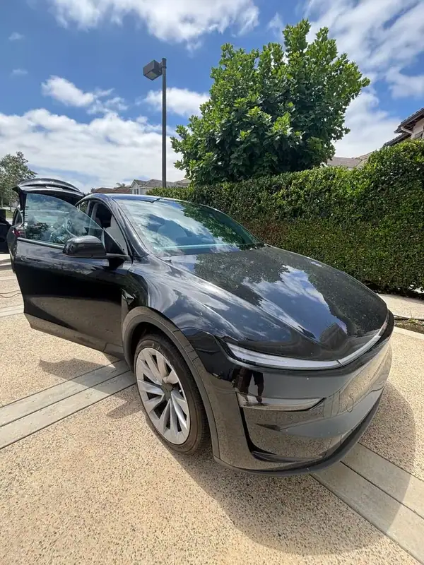 Black 2025 Tesla Model Y after 70% ceramic windshield, 70% front two windows, and 5% rear & back glass HiTek ceramic window tint by BestAutoTechs mobile window tinting in Orange County