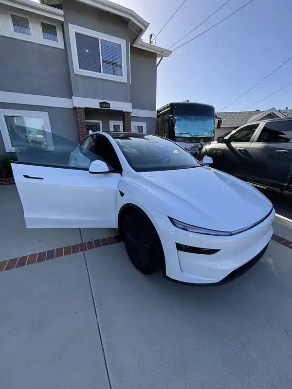 Pearl White 2026 Tesla Model Y Premium 'Highland' refresh with ceramic window tint installed by BestAutoTechs mobile window tinting in San Diego