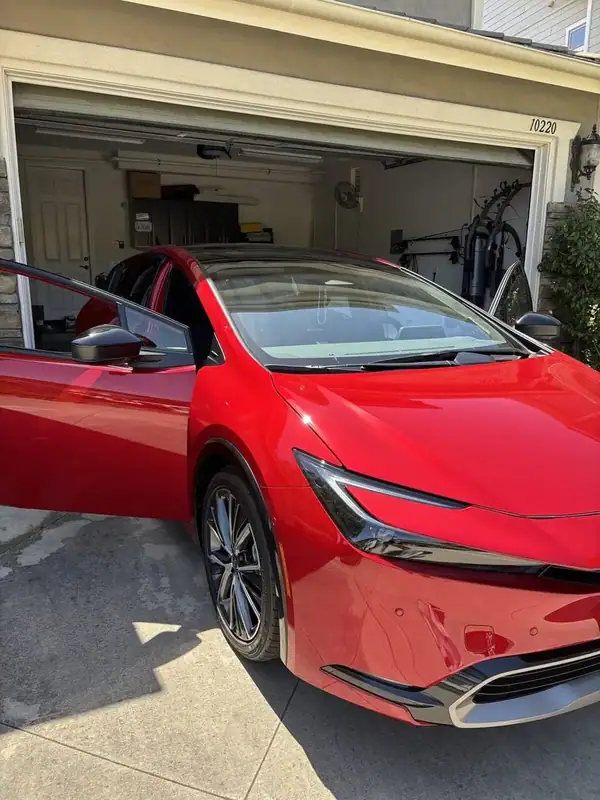 Red Toyota Prius Limited passenger side after ceramic window tint installation — BestAutoTechs San Diego mobile