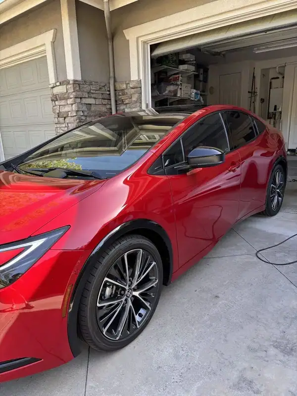 Red Toyota Prius Limited 5th-generation hybrid with ceramic window tint installed by BestAutoTechs mobile window tinting in San Diego