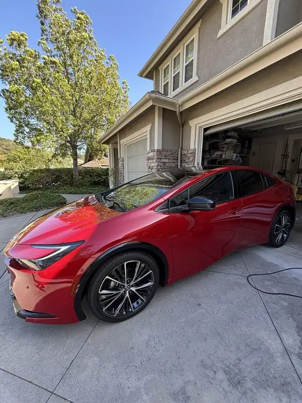 Red Toyota Prius Limited driver-side three-quarter view after ceramic IR window tint install — BestAutoTechs San Diego mobile service