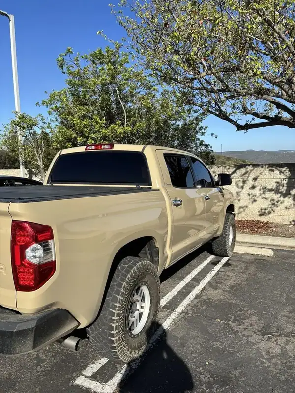Toyota Tacoma Super Cab passenger side with dark ceramic IR tint on cab glass — mobile window tinting San Diego