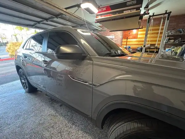 Volkswagen Atlas Cross Sport driver side showing ceramic window tint on front windows — mobile tinting San Diego