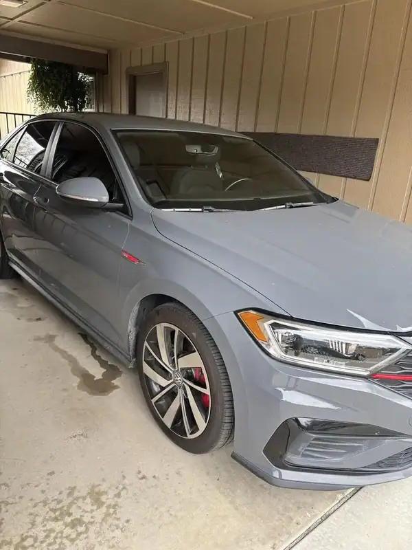 Nardo Gray Volkswagen Jetta GLI with full ceramic window tint installed by BestAutoTechs mobile window tinting in San Diego