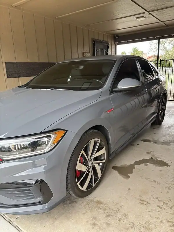 Volkswagen Jetta GLI rear glass with ceramic window tint completed in driveway — mobile tinting San Diego